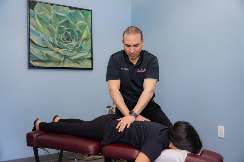 Chiropractor performing an adjustment on a patient at Ornelas Chiropractic to relieve pain and improve mobility.